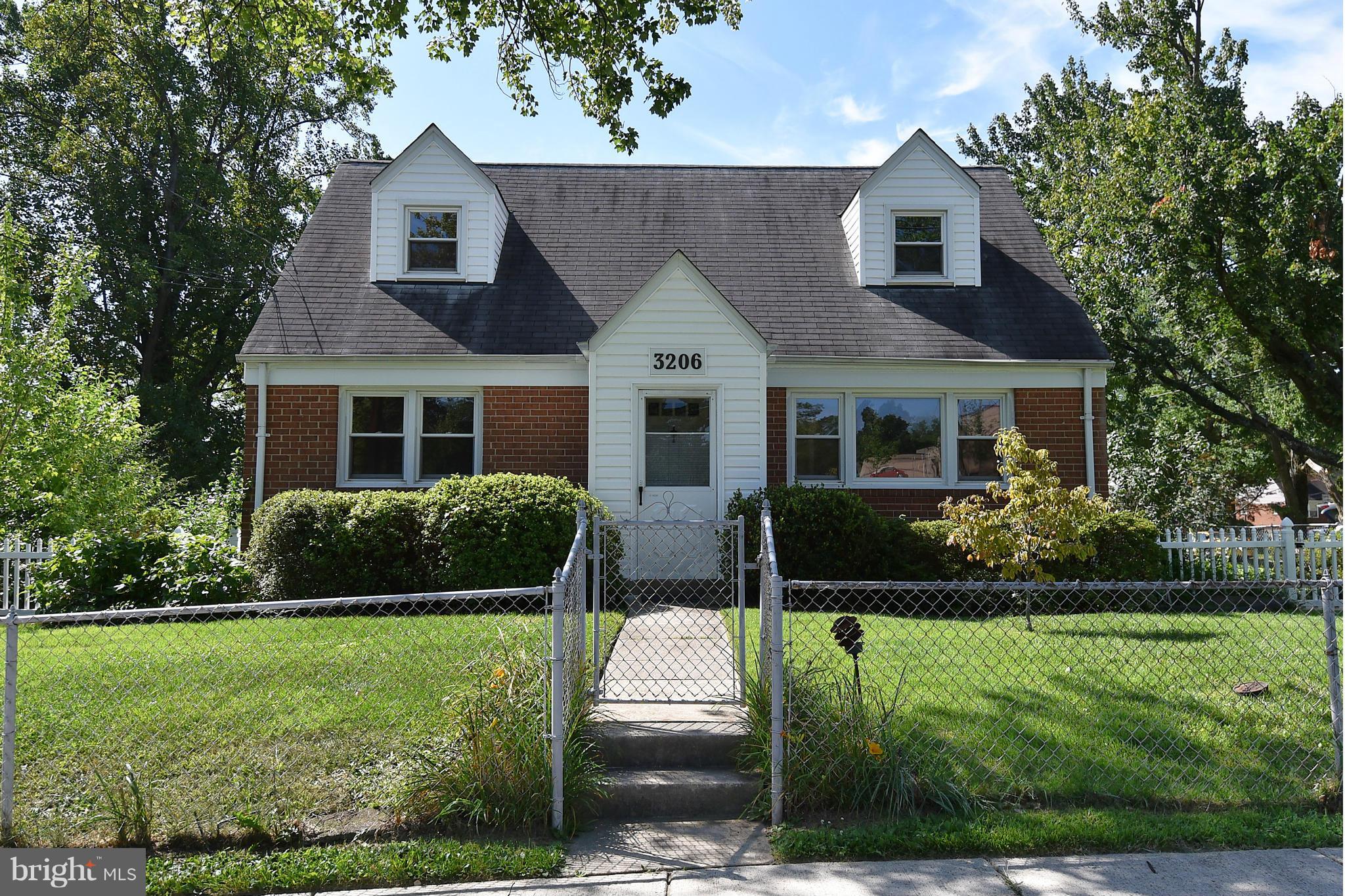 3206 Weller Road Silver Spring, MD 20906 - Photo 1 of 30 a front view of a house with a yard