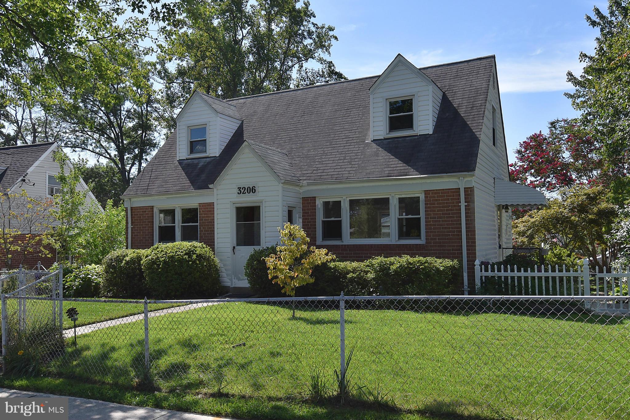 3206 Weller Road Silver Spring, MD 20906 - Photo 2 of 30 a front view of a house with a yard and porch