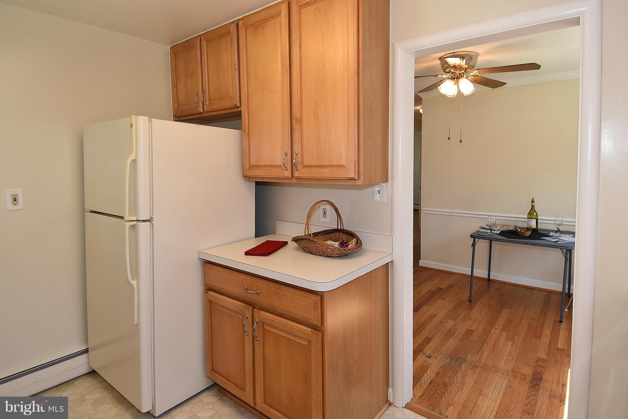 3206 Weller Road Silver Spring, MD 20906 - Photo 12 of 30 a kitchen with a refrigerator and a sink