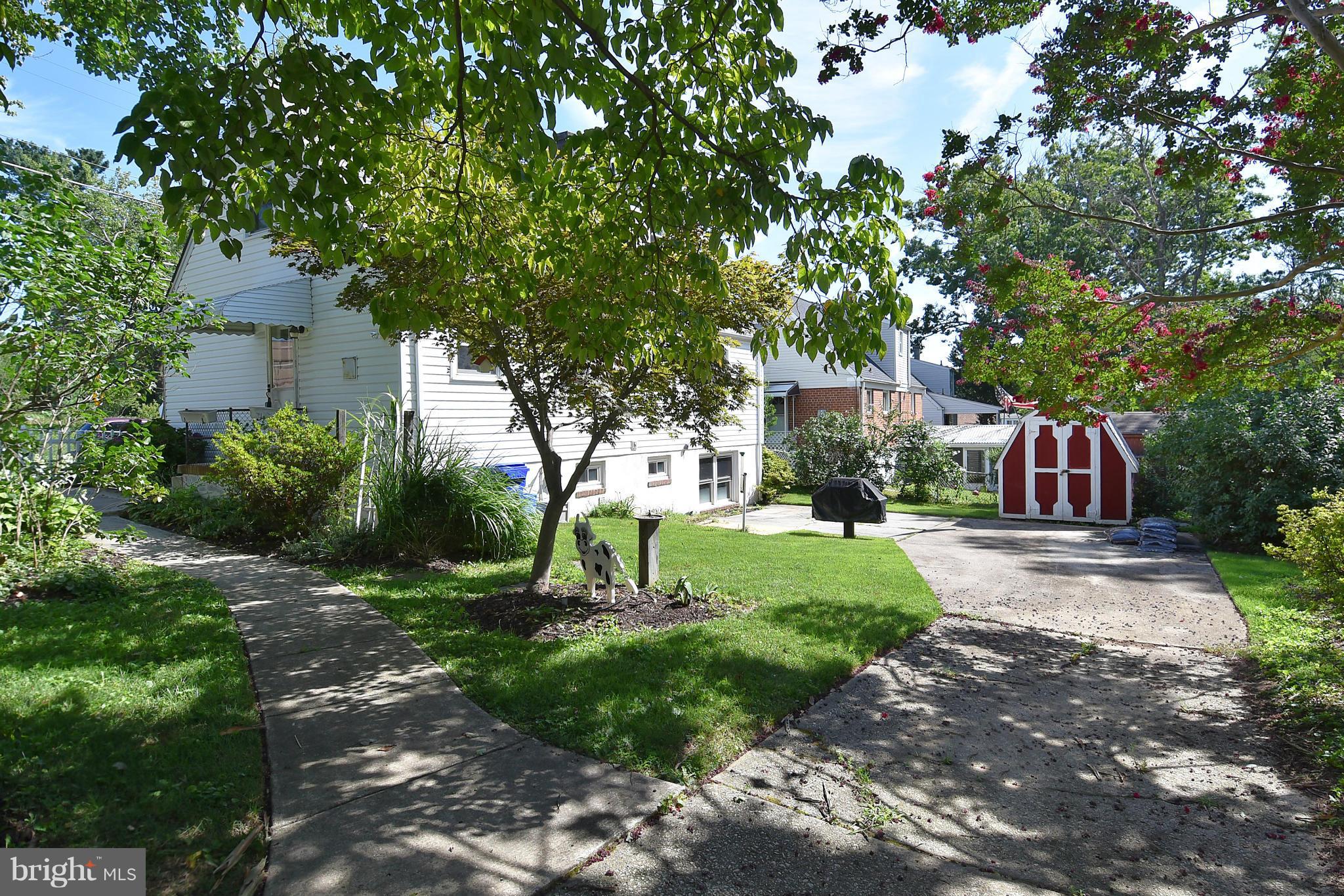 3206 Weller Road Silver Spring, MD 20906 - Photo 3 of 30 a view of a street with a tree
