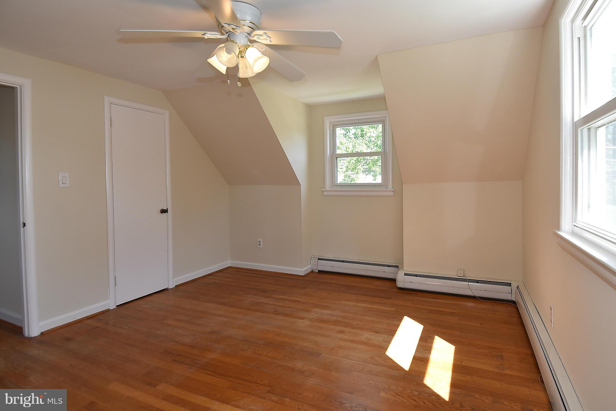 3206 Weller Road Silver Spring, MD 20906 - Photo 24 of 30 an empty room with windows and fan