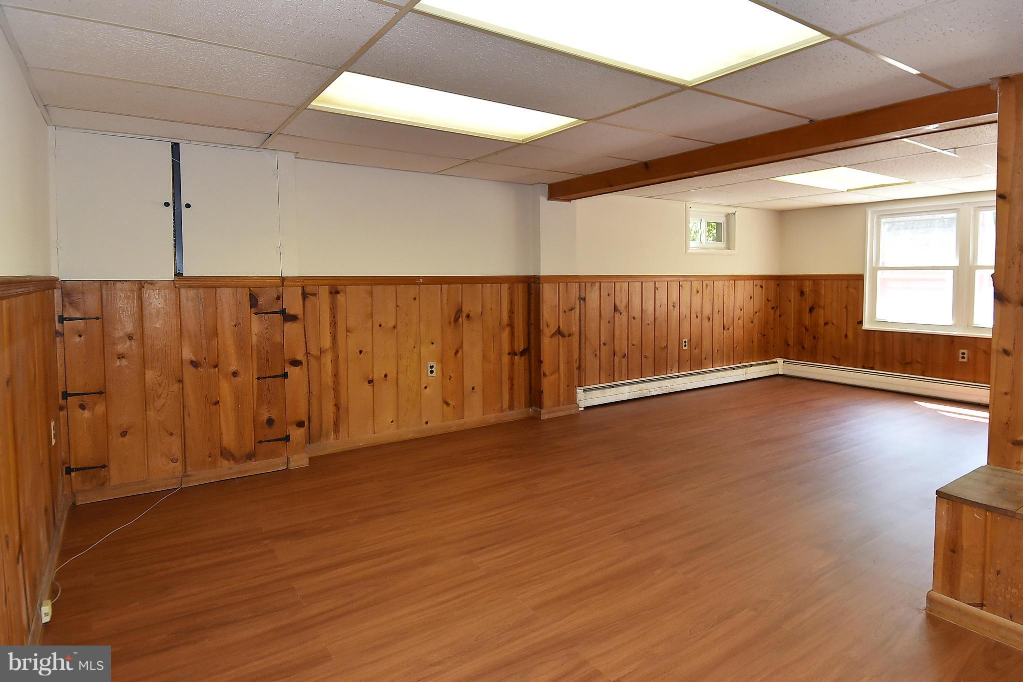 3206 Weller Road Silver Spring, MD 20906 - Photo 28 of 30 an empty room with wooden floor and windows