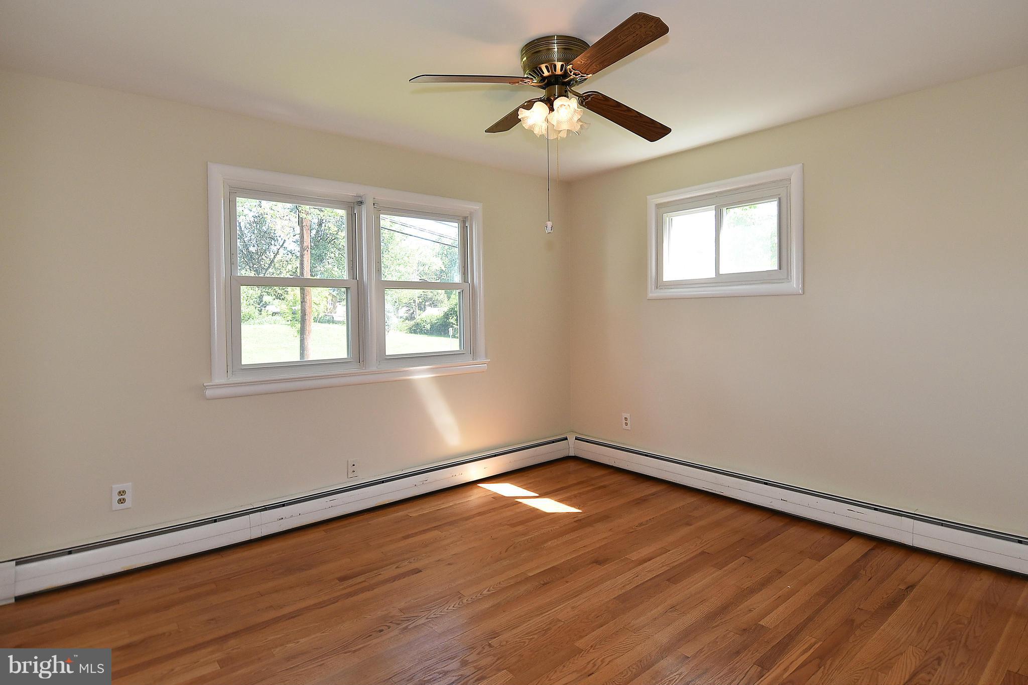 3206 Weller Road Silver Spring, MD 20906 - Photo 7 of 30 a view of empty room with wooden floor and fan