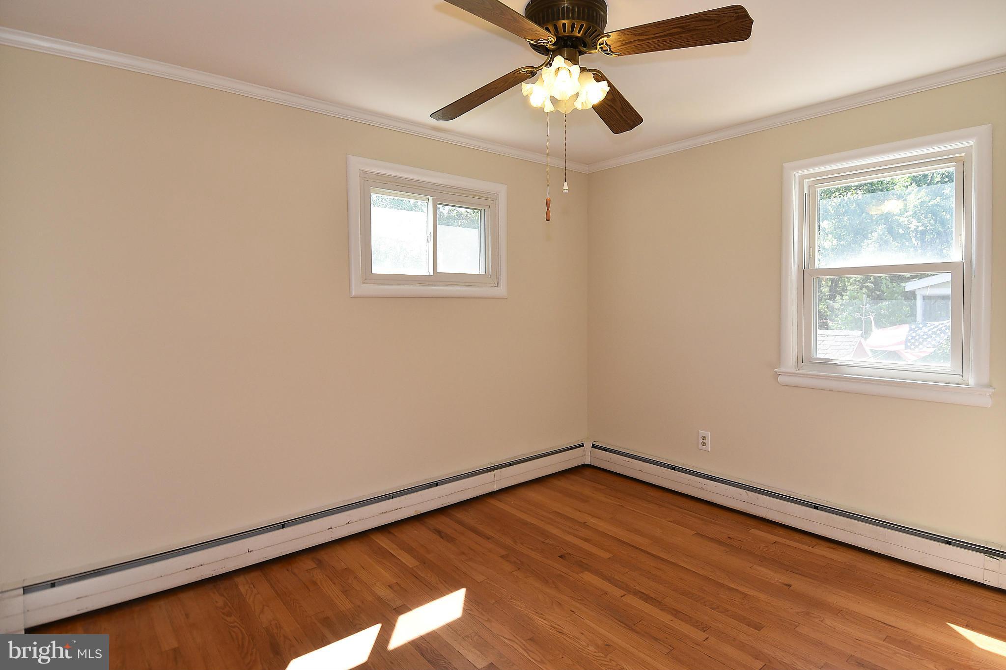3206 Weller Road Silver Spring, MD 20906 - Photo 8 of 30 a view of empty room with wooden floor and fan