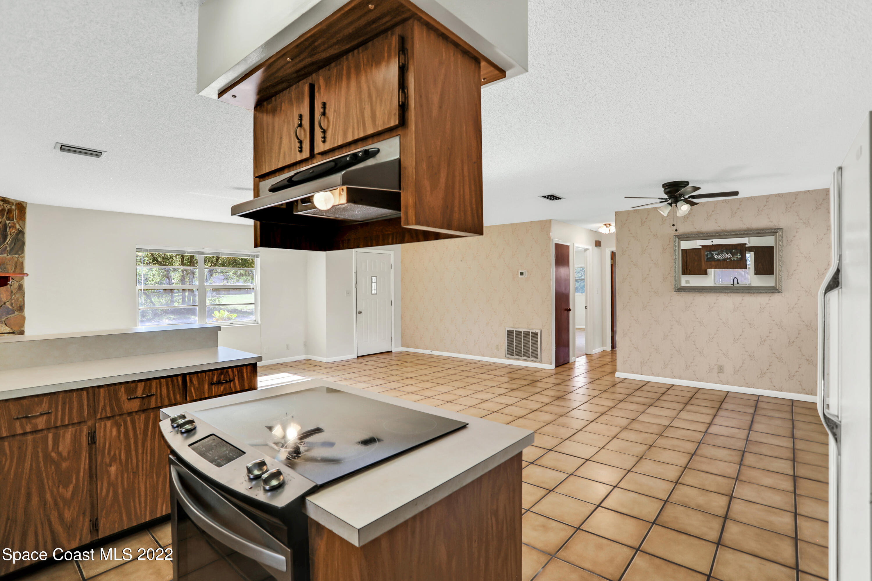 4124 April Lane Mims, FL 32754 - Photo 23 of 44 a view of kitchen with cabinets and window
