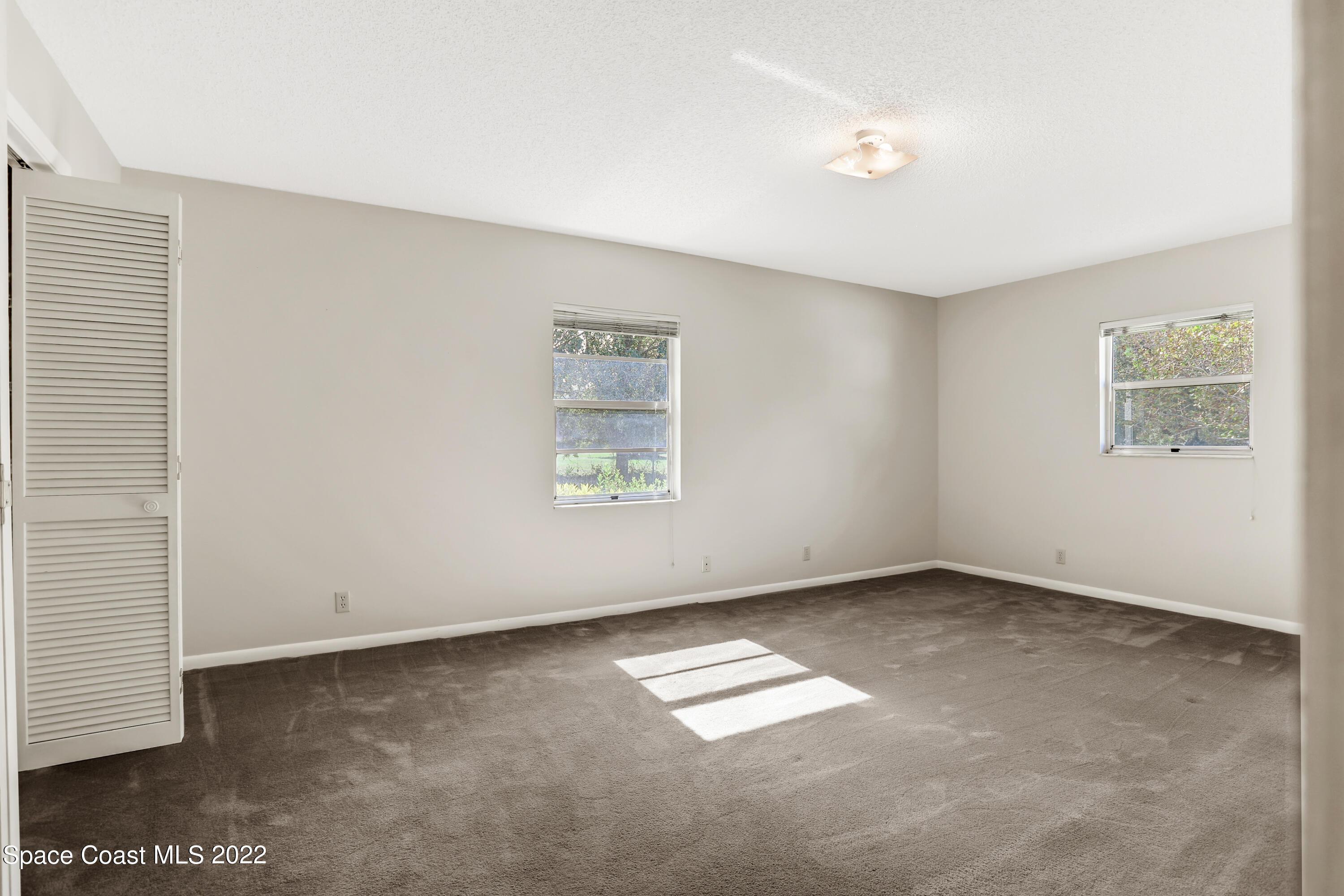 4124 April Lane Mims, FL 32754 - Photo 34 of 44 an empty room with windows