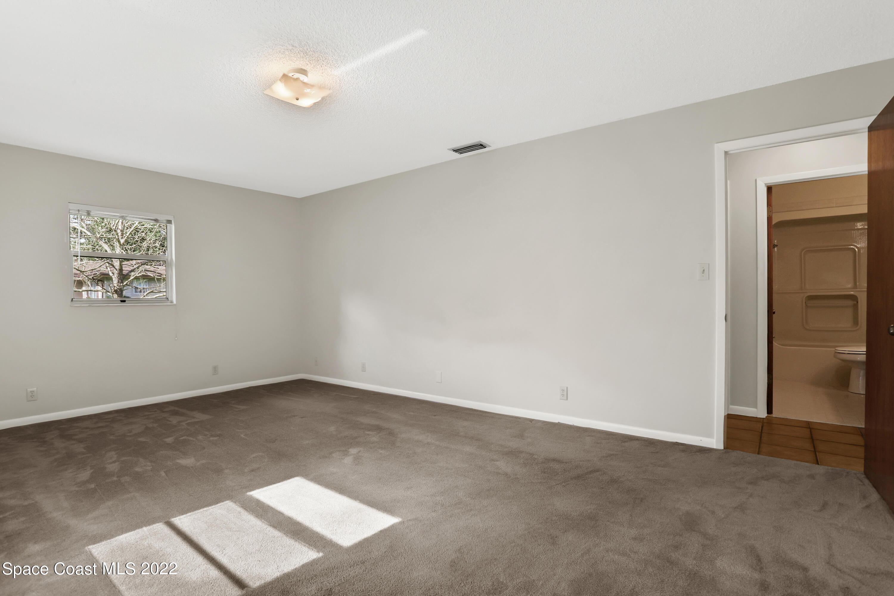 4124 April Lane Mims, FL 32754 - Photo 36 of 44 an empty room with a window