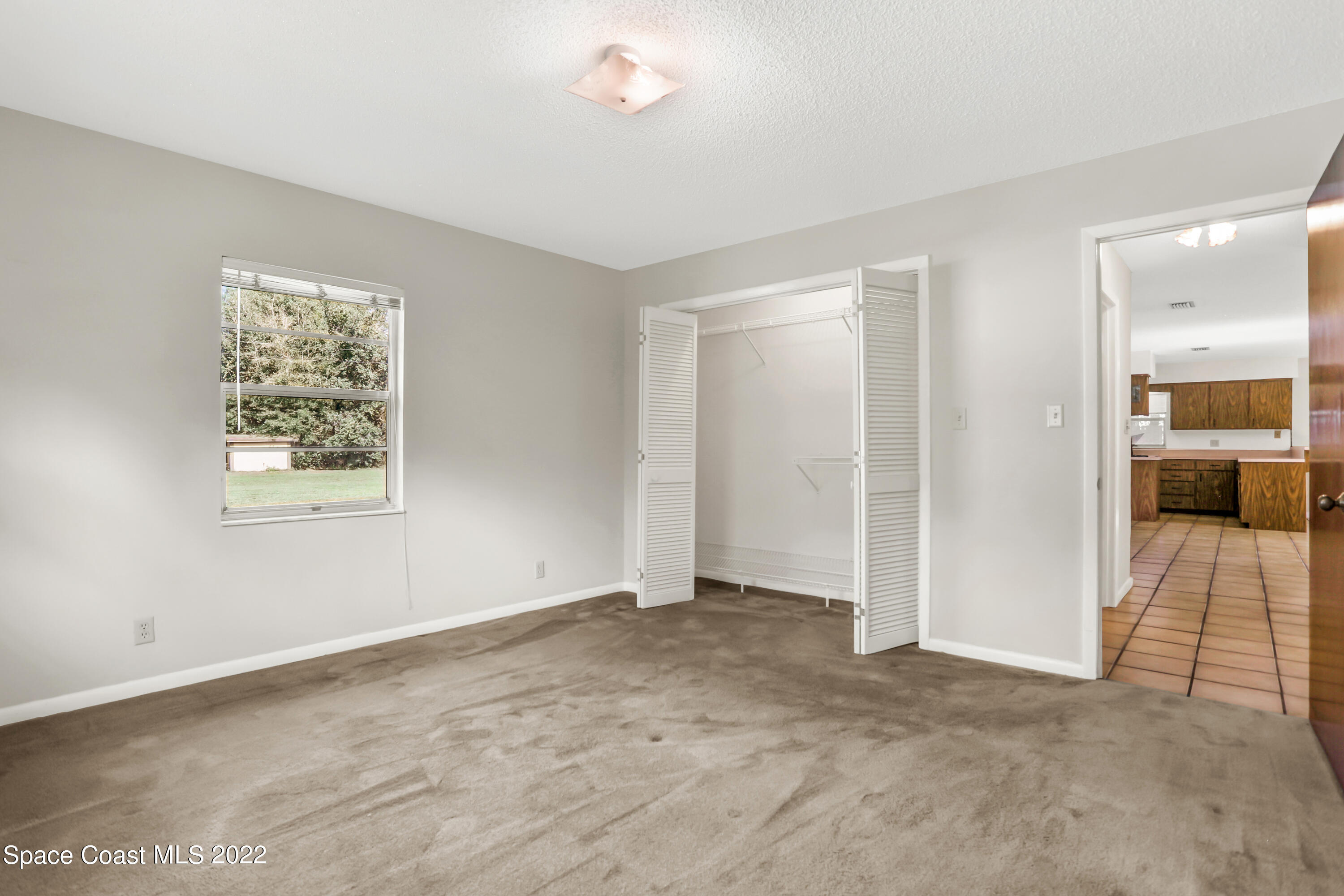 4124 April Lane Mims, FL 32754 - Photo 39 of 44 an empty room with a bathroom