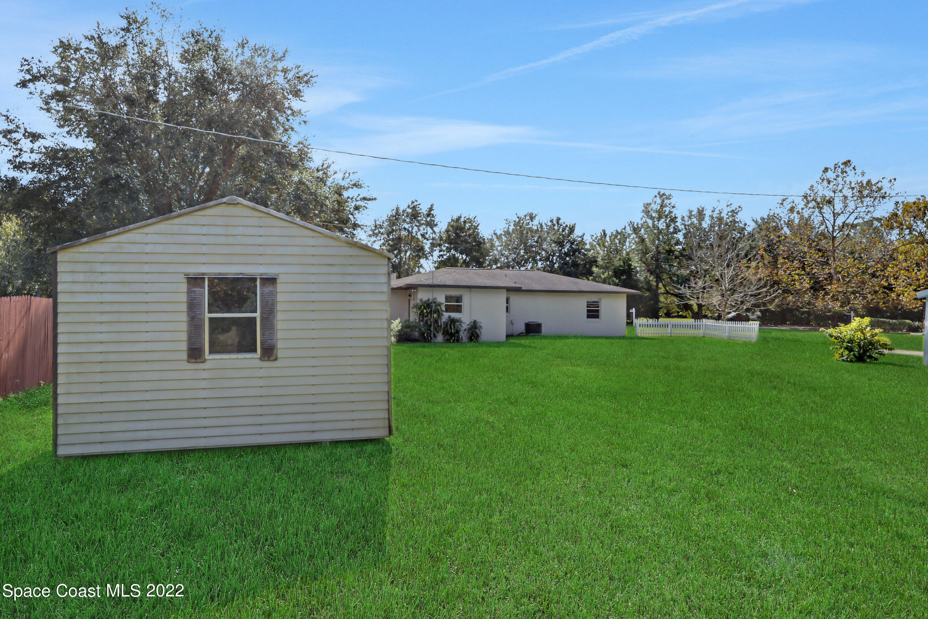 4124 April Lane Mims, FL 32754 - Photo 8 of 44 a view of a house with a yard