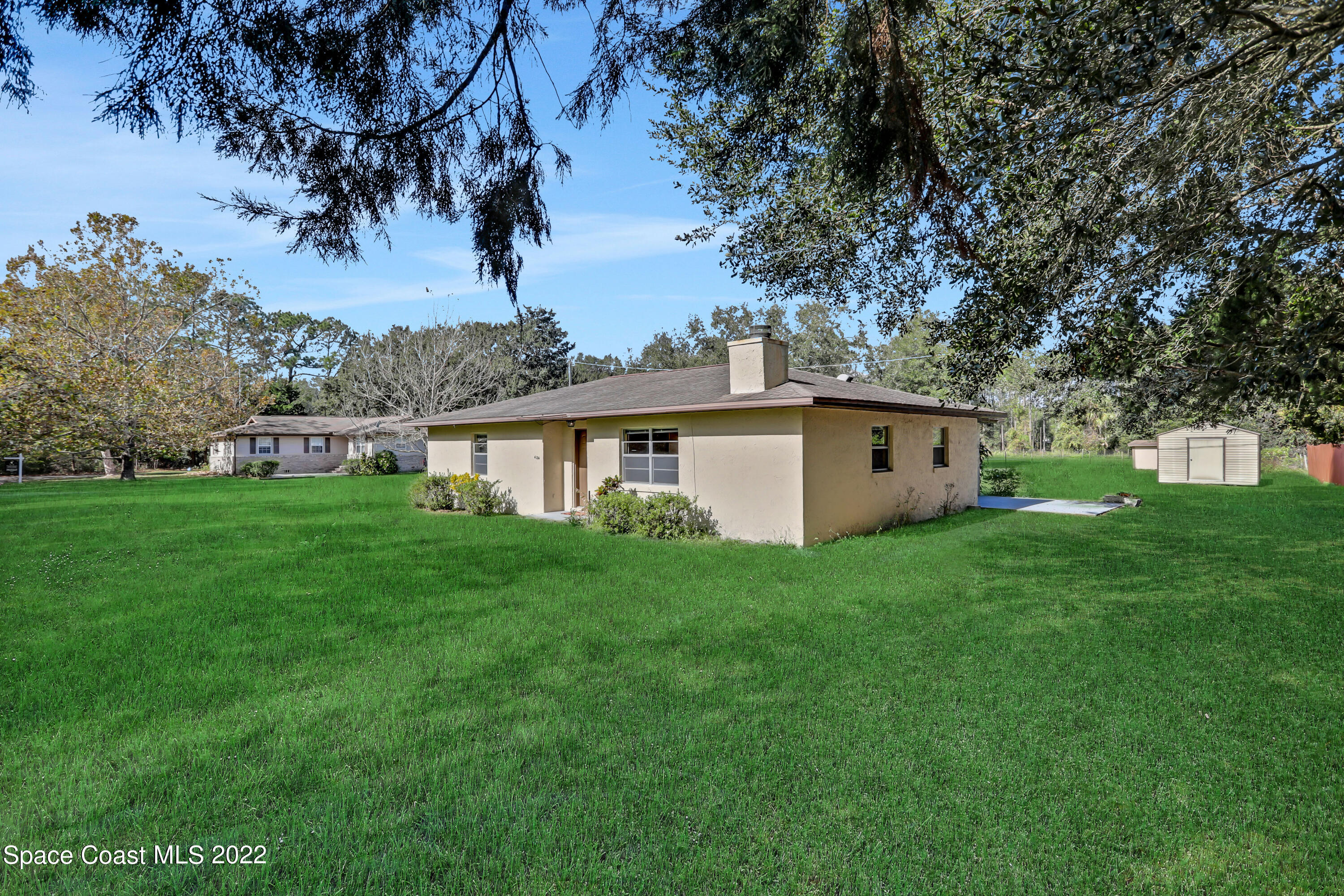 4124 April Lane Mims, FL 32754 - Photo 10 of 44 a view of a house with a yard