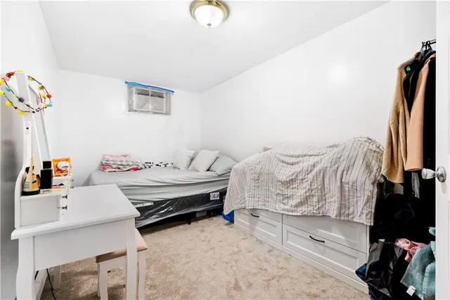 a bedroom with furniture and a wooden floor