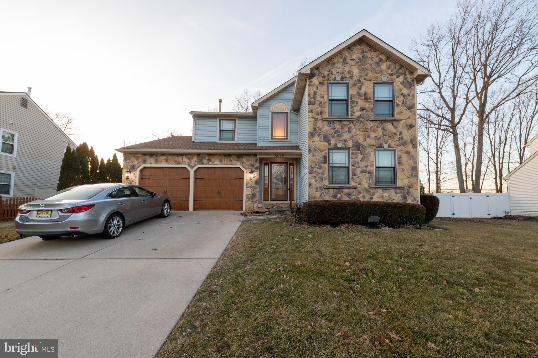 a view of a car in front of house