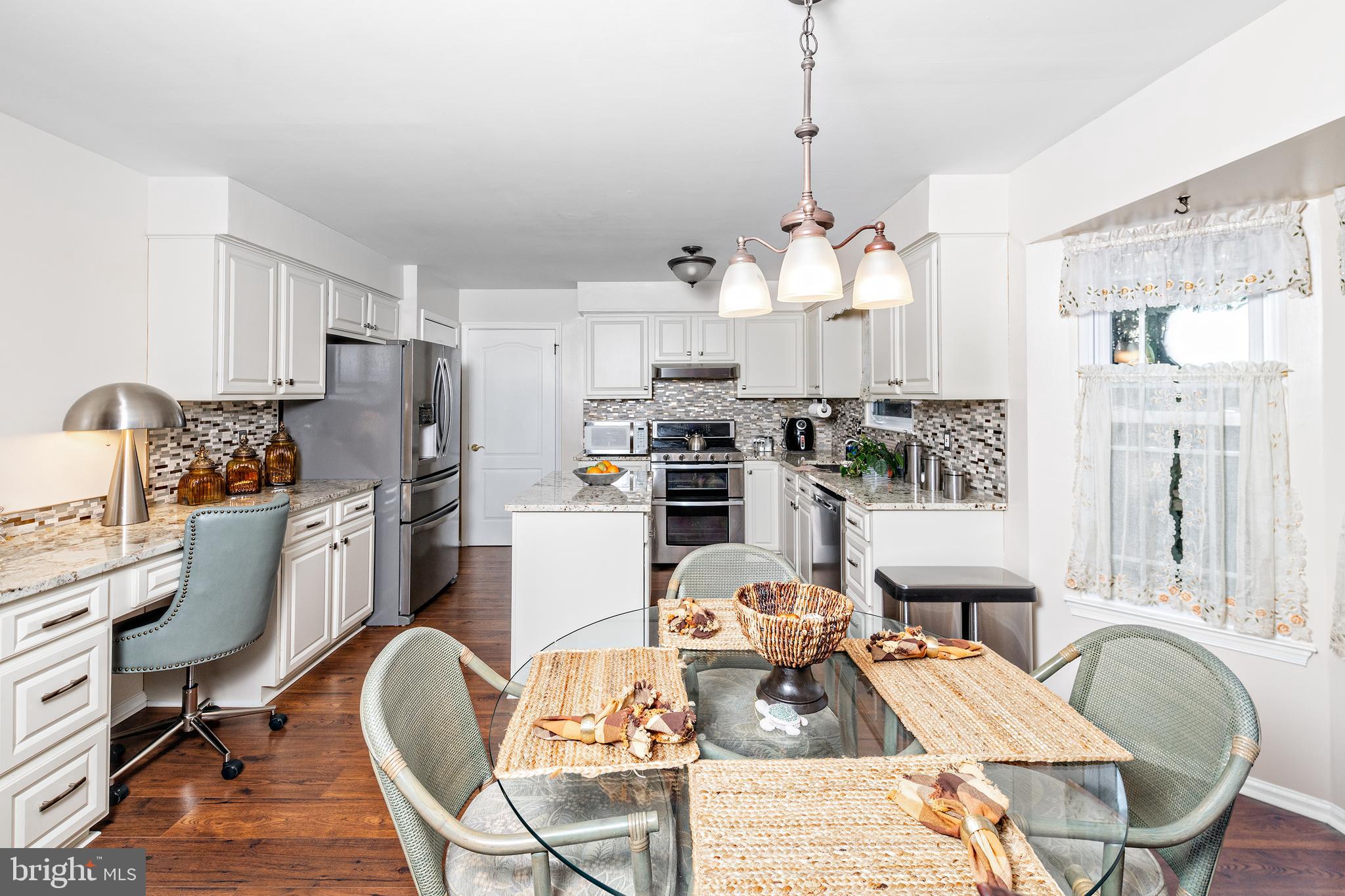 72 Rosalind Circle Sicklerville, NJ 08081 - Photo 11 of 47 a living room with furniture a dining table and a chandelier