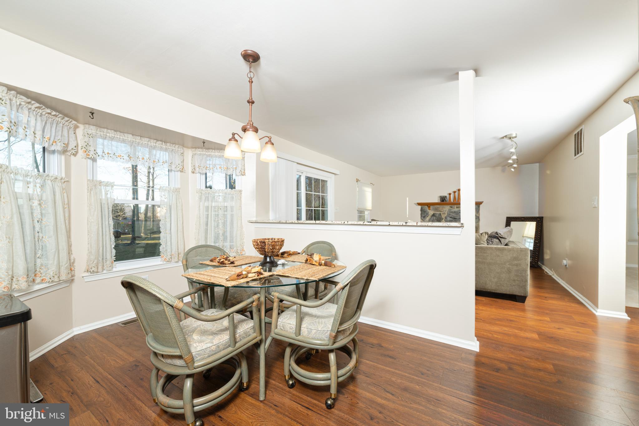 72 Rosalind Circle Sicklerville, NJ 08081 - Photo 12 of 47 a dining room with furniture a chandelier and wooden floor