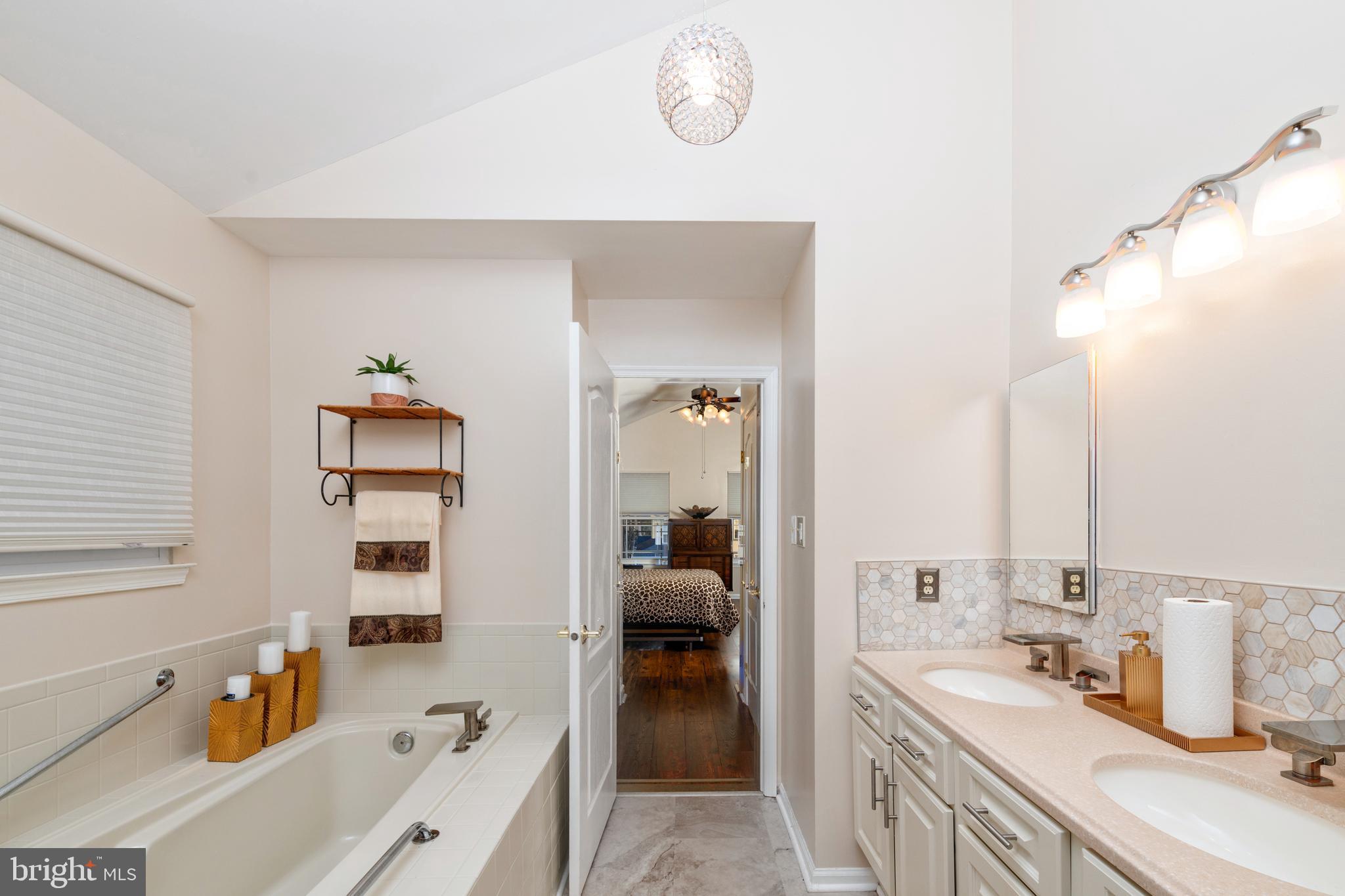 72 Rosalind Circle Sicklerville, NJ 08081 - Photo 25 of 47 a bathroom with a tub sink and mirror