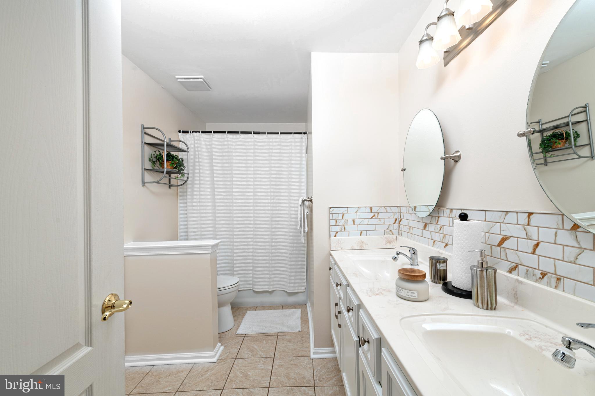72 Rosalind Circle Sicklerville, NJ 08081 - Photo 26 of 47 a bathroom with a sink and a mirror