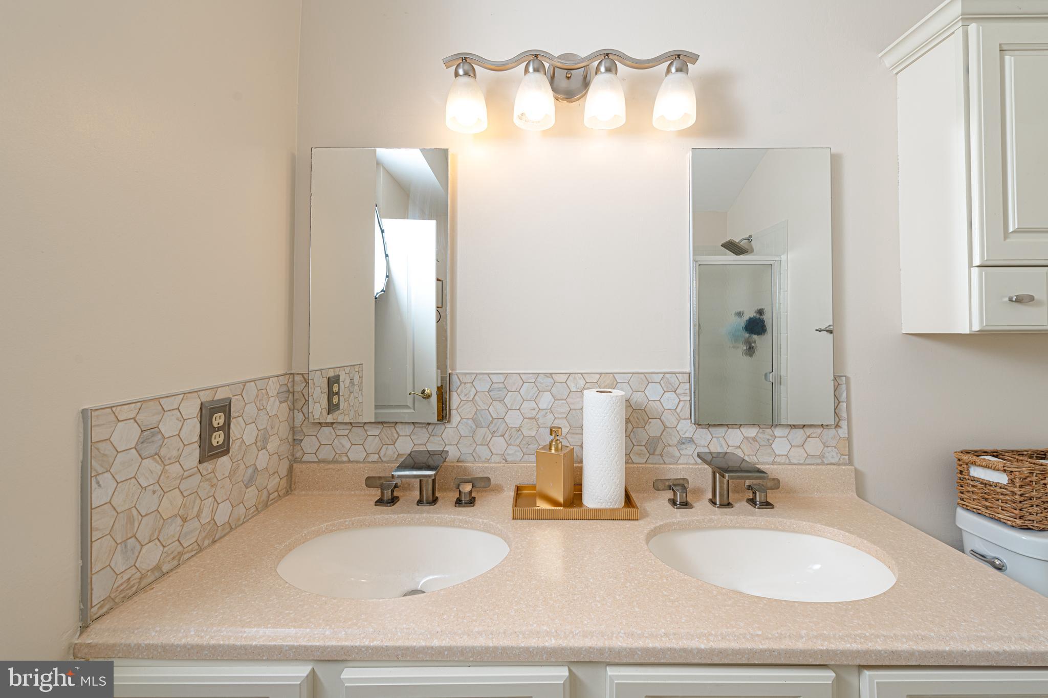 72 Rosalind Circle Sicklerville, NJ 08081 - Photo 28 of 47 a bathroom with a sink and a mirror