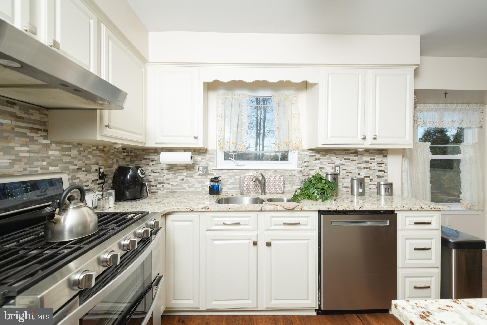 72 Rosalind Circle Sicklerville, NJ 08081 - Photo 9 of 47 a kitchen with granite countertop a sink stainless steel appliances and cabinets