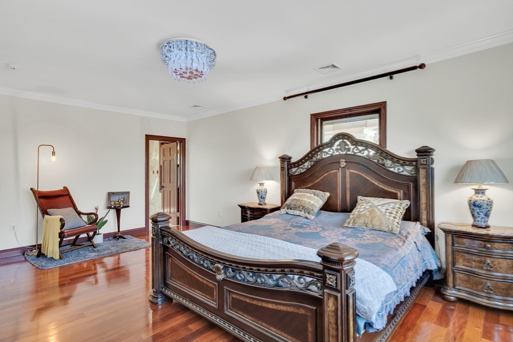95 Commonwealth Avenue Newton, MA 02467 - Photo 21 of 42 a bedroom with a bed and wooden floor