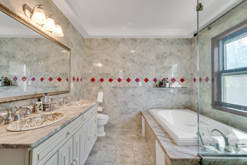 95 Commonwealth Avenue Newton, MA 02467 - Photo 22 of 42 a bathroom with a sink mirror and a bathtub