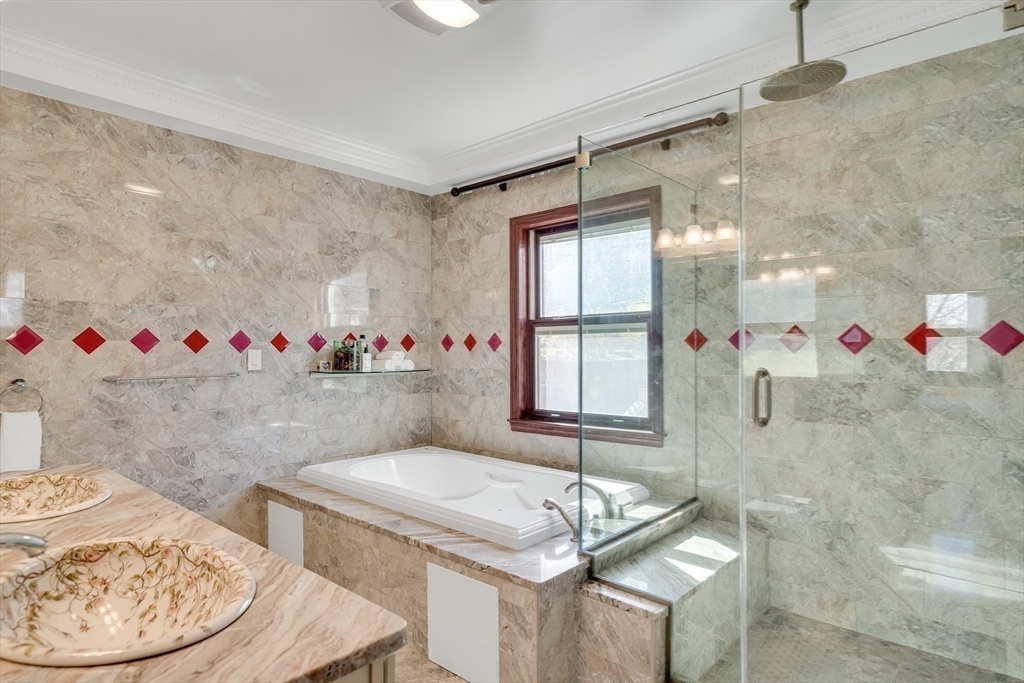 95 Commonwealth Avenue Newton, MA 02467 - Photo 23 of 42 a bathroom with a granite countertop sink and a mirror