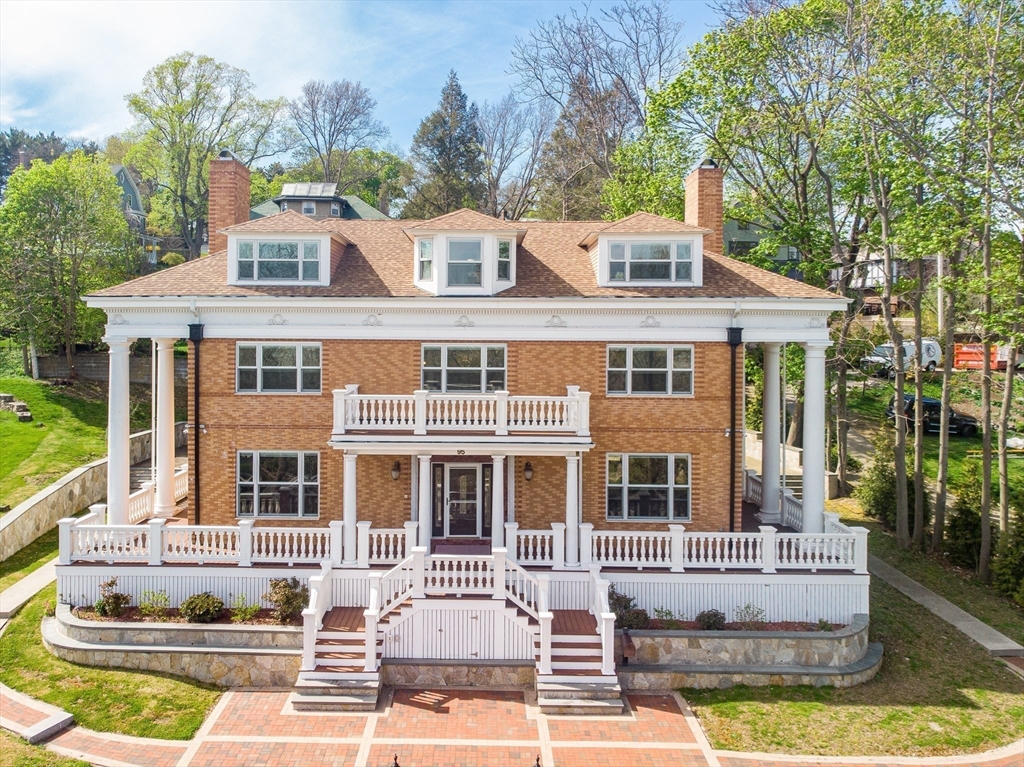 95 Commonwealth Avenue Newton, MA 02467 - Photo 4 of 42 a front view of a house with a garden