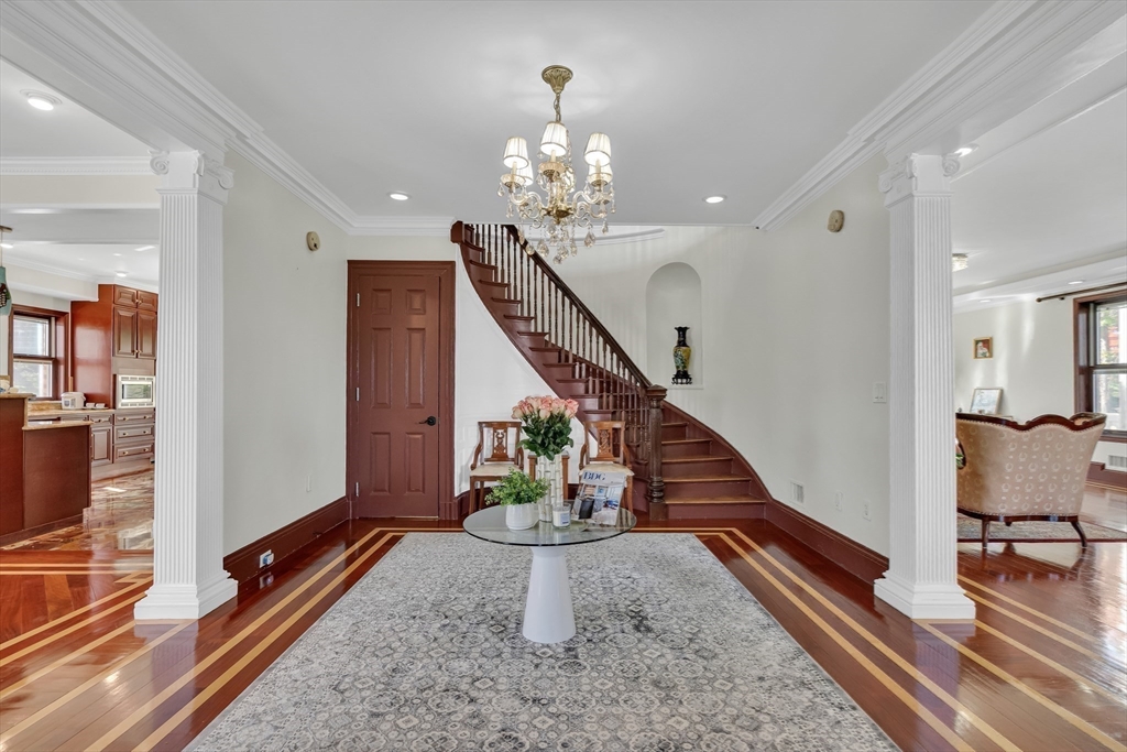 95 Commonwealth Avenue Newton, MA 02467 - Photo 8 of 42 a view of entryway and hall with wooden floor