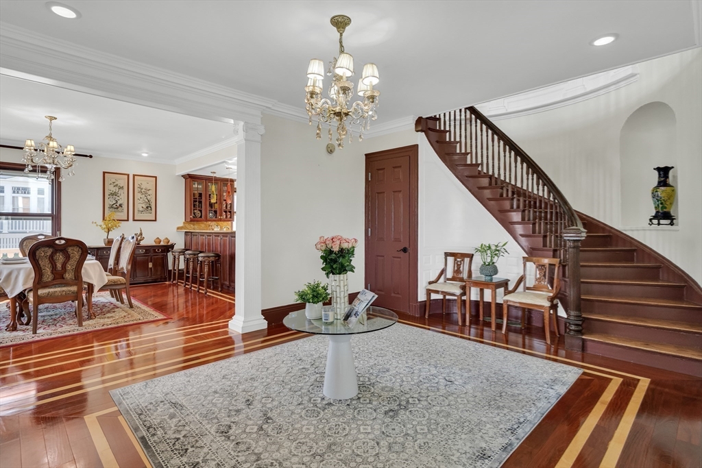 95 Commonwealth Avenue Newton, MA 02467 - Photo 9 of 42 a living room with furniture chandelier and wooden floor