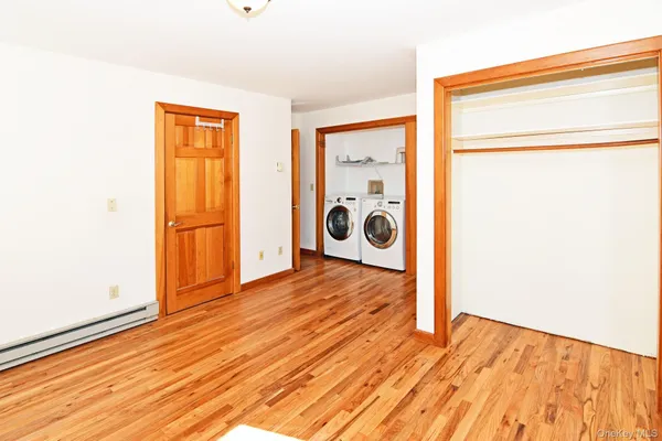 a view of a storage & utility room with wooden floor