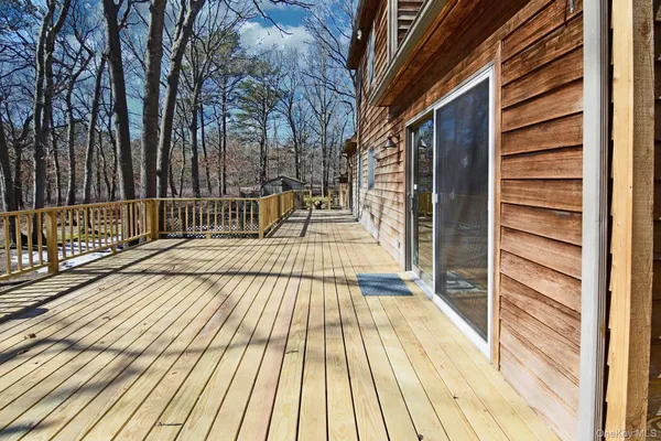 a view of outdoor space with deck and wooden floor