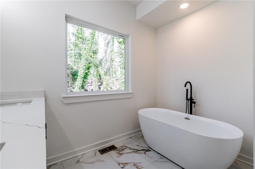 6121 Timberidge Drive Gainesville, GA 30506 - Photo 24 of 44 a white bath tub sitting next to a window