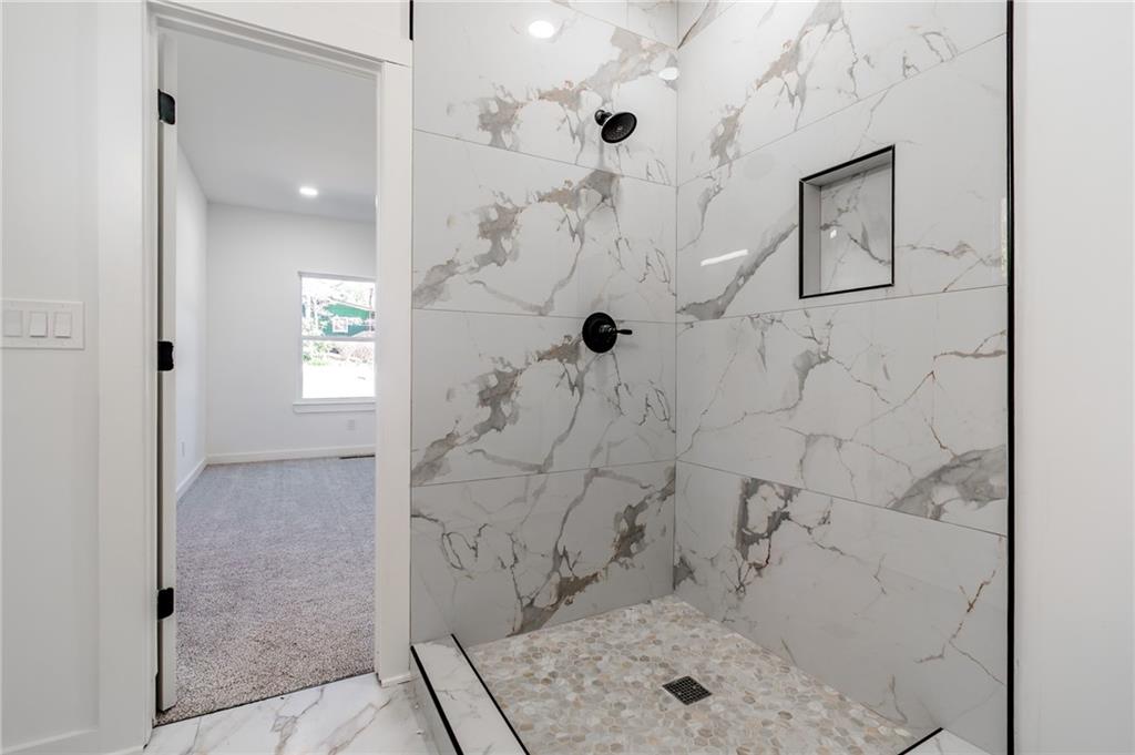 6121 Timberidge Drive Gainesville, GA 30506 - Photo 29 of 44 a bathroom with a granite countertop shower