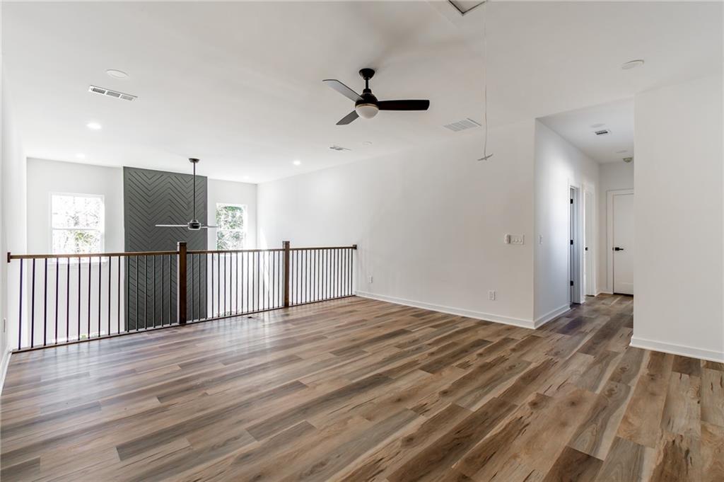 6121 Timberidge Drive Gainesville, GA 30506 - Photo 31 of 44 a view of a hallway with wooden floor