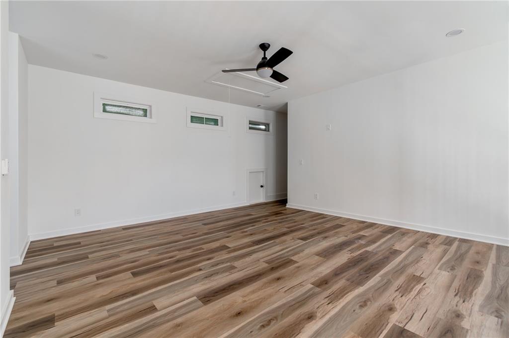 6121 Timberidge Drive Gainesville, GA 30506 - Photo 32 of 44 a view of empty room with wooden floor and ceiling fan