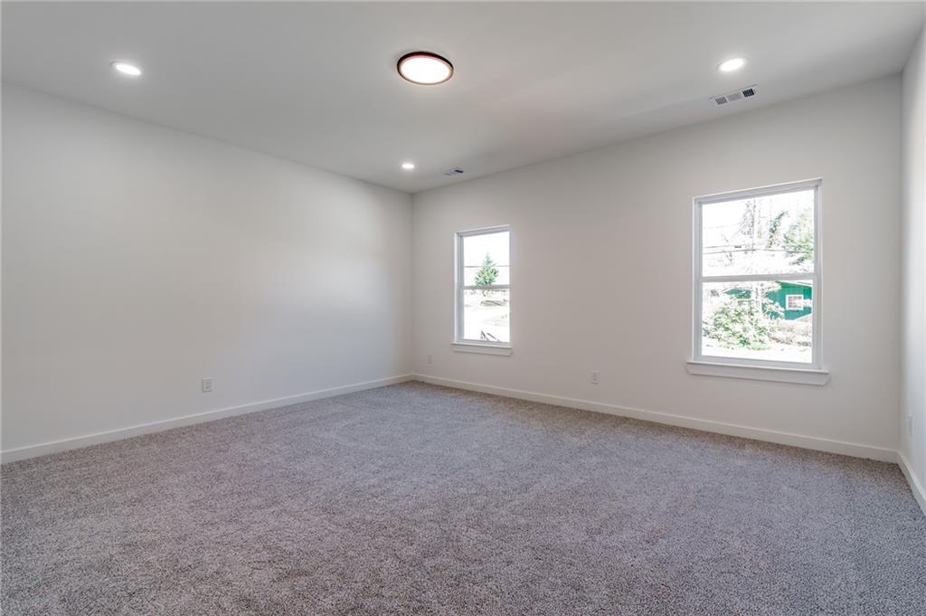 6121 Timberidge Drive Gainesville, GA 30506 - Photo 36 of 44 an empty room with windows