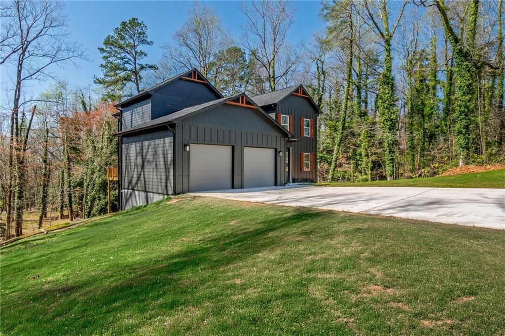 6121 Timberidge Drive Gainesville, GA 30506 - Photo 5 of 44 a front view of a house with a garden