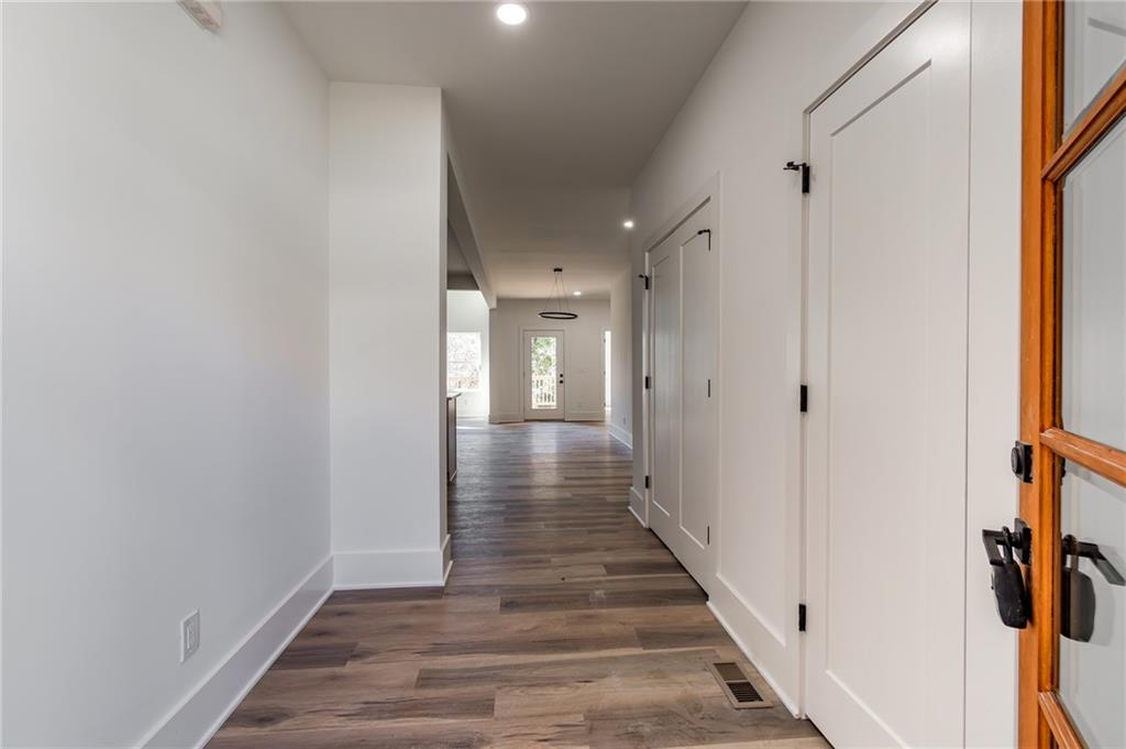 6121 Timberidge Drive Gainesville, GA 30506 - Photo 8 of 44 a view of a hallway with wooden floor and staircase