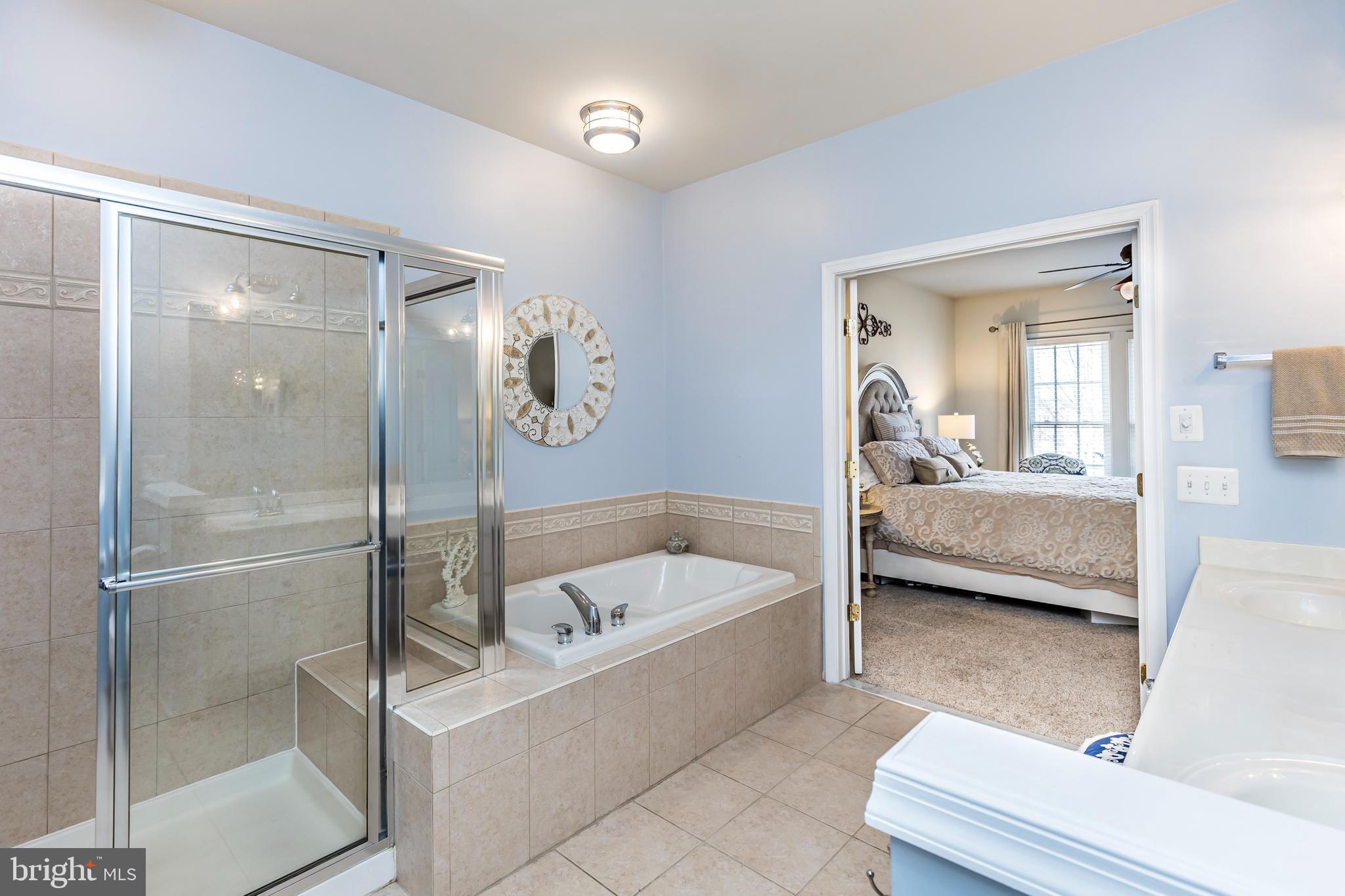 8228 Academy Road, Unit 19 Ellicott City, MD 21043 - Photo 43 of 72 Main level primary luxury bath with w/in closet