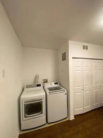a view of kitchen with stainless steel appliances refrigerator sink and stove