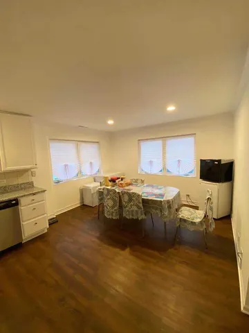 a bedroom with a bed and chair