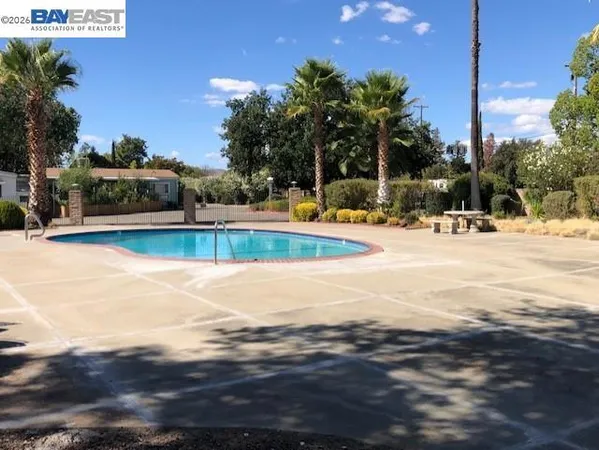 a view of a swimming pool with a patio