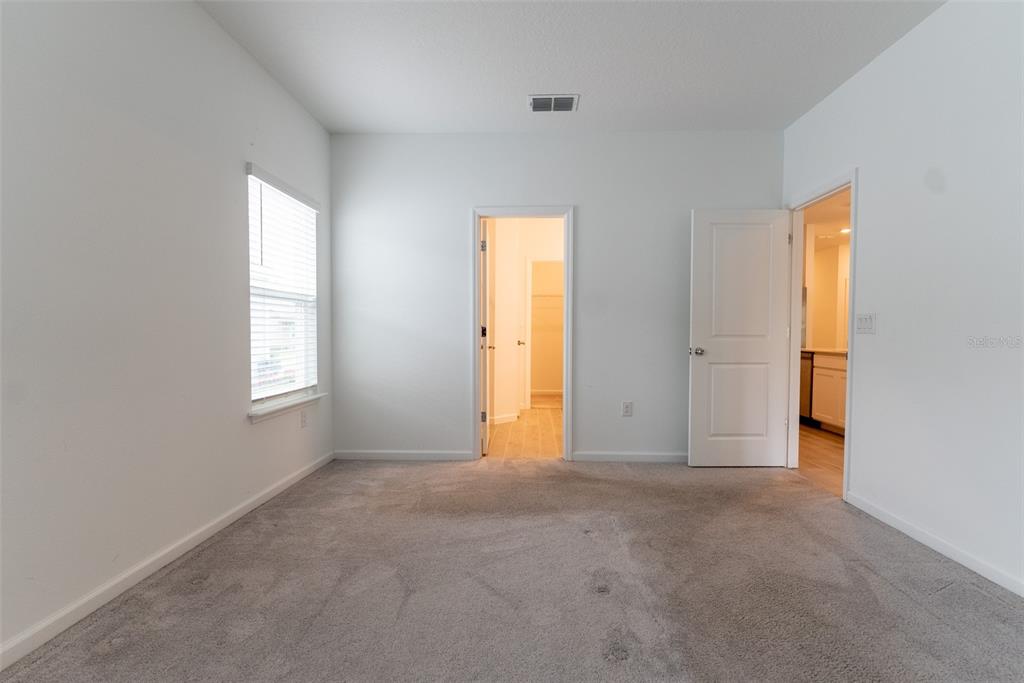 4501 Northwest 14th Loop Ocala, FL 34482 - Photo 2 of 38 a view of an empty room with a window