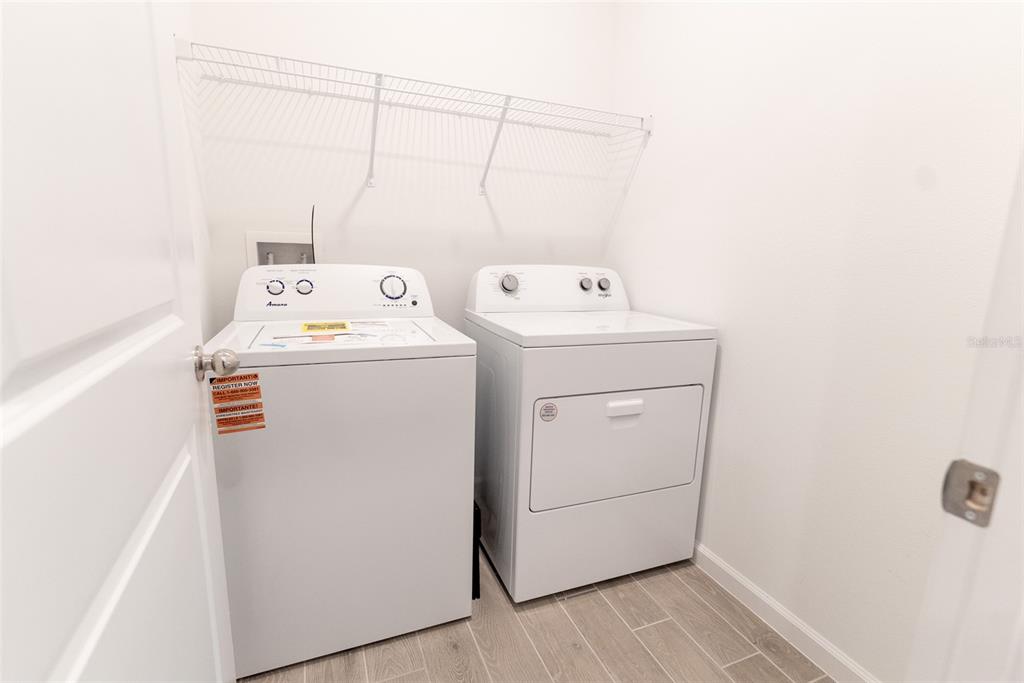 4501 Northwest 14th Loop Ocala, FL 34482 - Photo 28 of 38 a utility room with dryer and washer