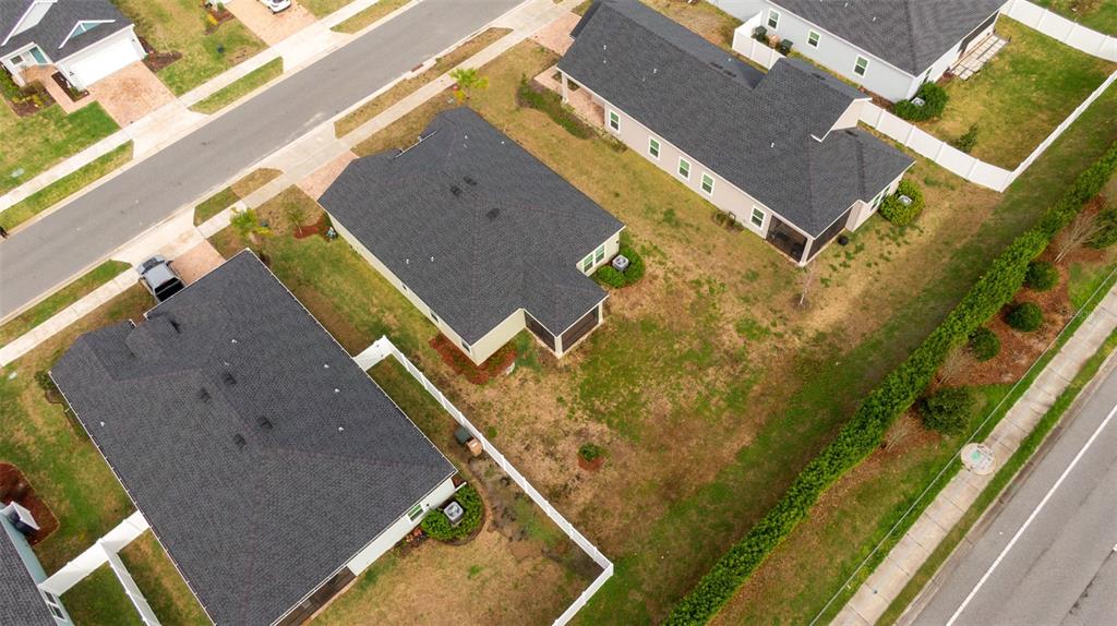 4501 Northwest 14th Loop Ocala, FL 34482 - Photo 36 of 38 an aerial view of a house with a yard