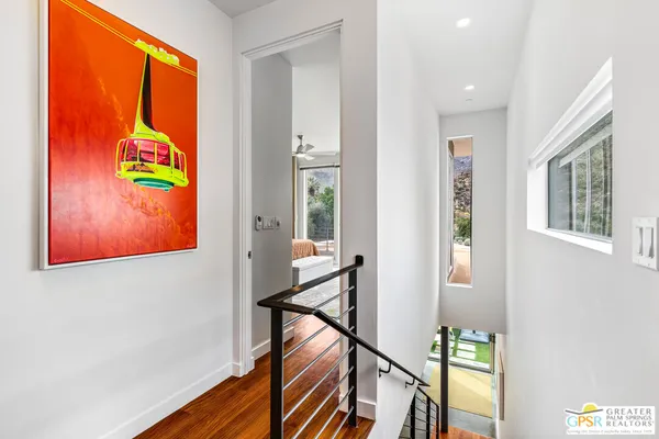 a spacious bedroom with a bed and a large window