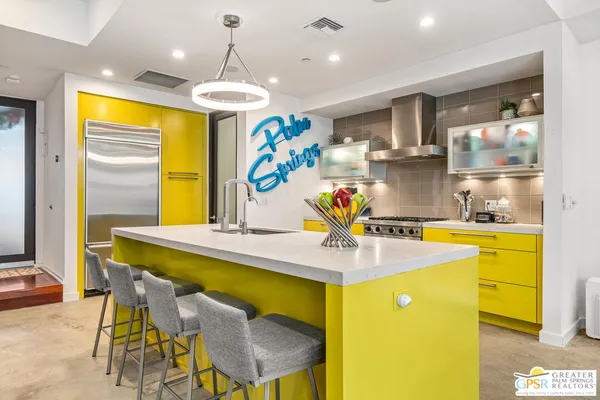 a dining hall with a table and chairs