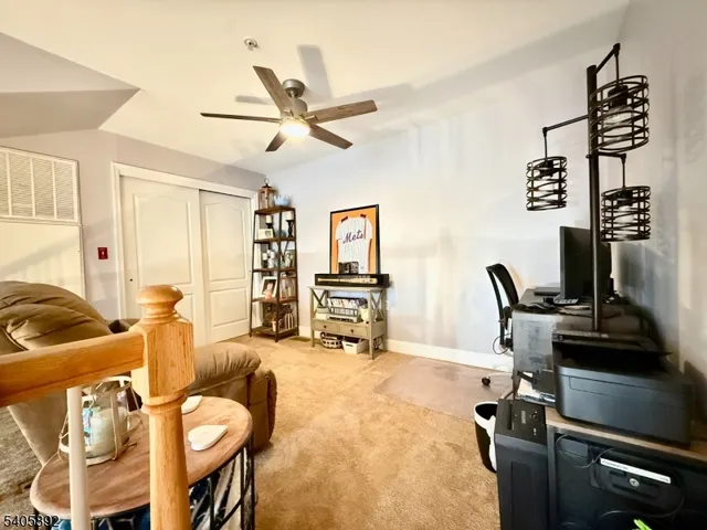 a view of a livingroom with furniture and a flat screen tv