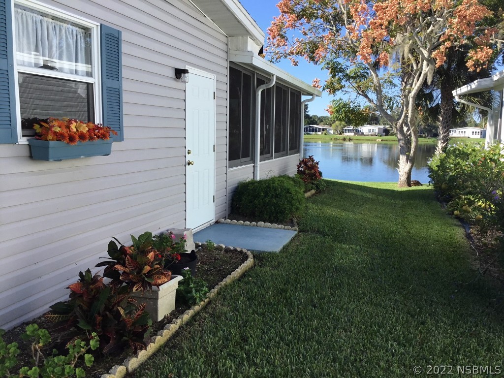 752 Navigators Way Edgewater, FL 32141 - Photo 4 of 14 a backyard of a house with lots of green space