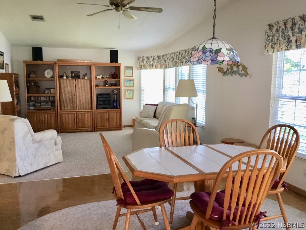 752 Navigators Way Edgewater, FL 32141 - Photo 5 of 14 a view of a dining room with furniture