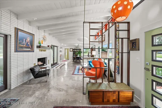 a kitchen with stainless steel appliances kitchen island granite countertop a refrigerator and stove